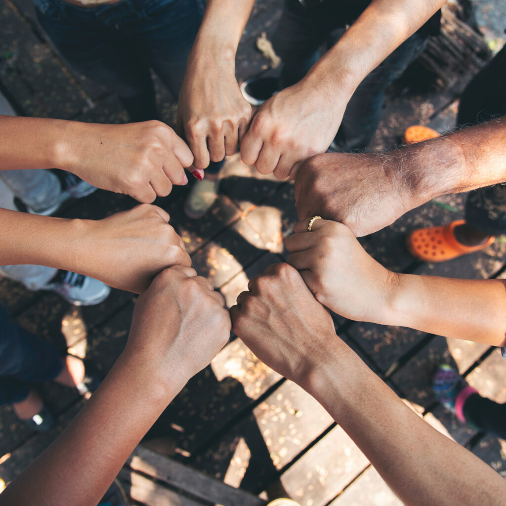 Diverse multiethnic Partners hands together teamwork